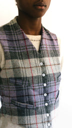 Close up of African woman wearing View C 222 Vintage Vests, collarless and four welts pockets